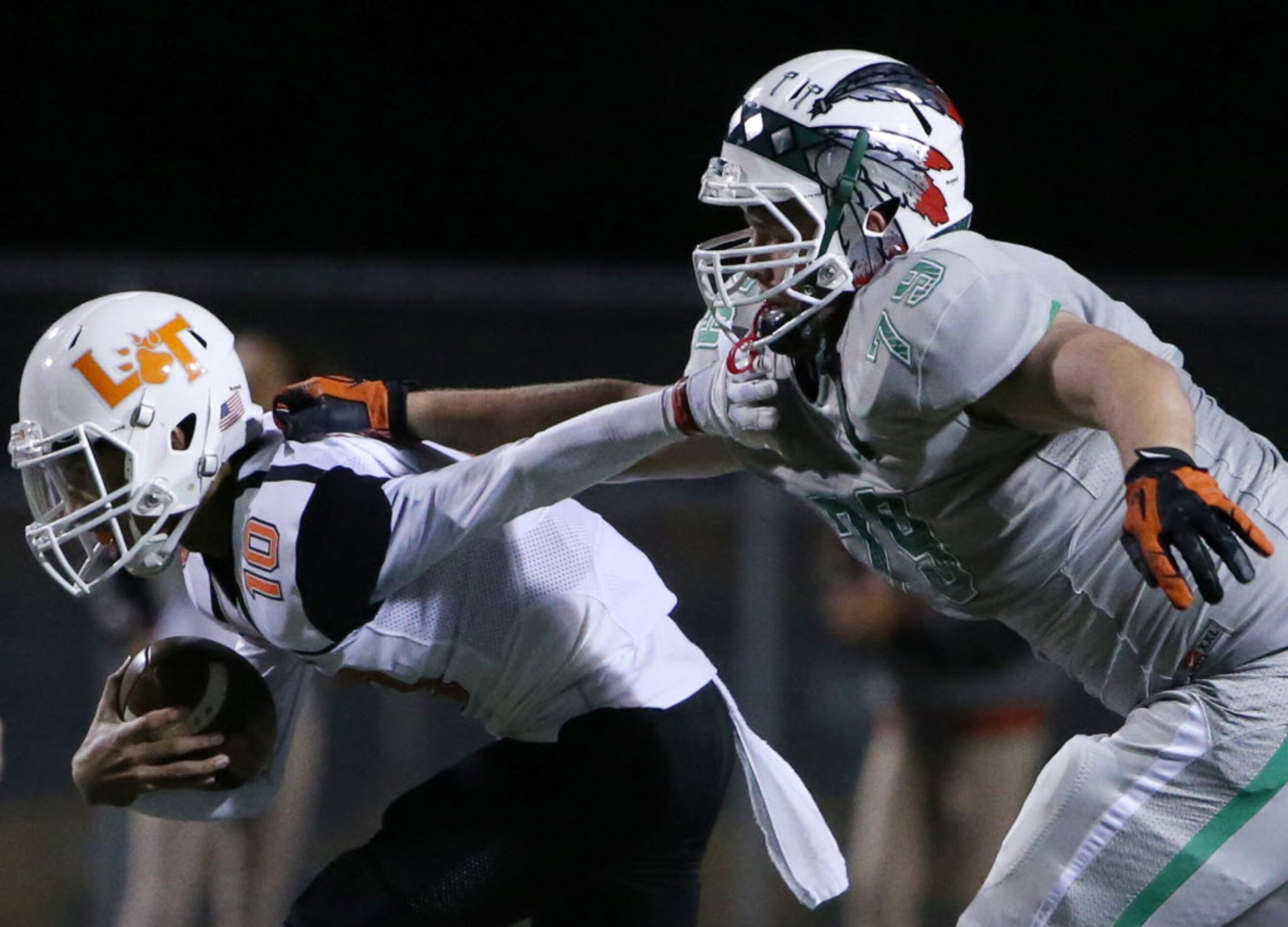 Waxahachie defensive lineman Trevor Thielen (79) sacks Lancaster quarterback Ryan Ross (1)...