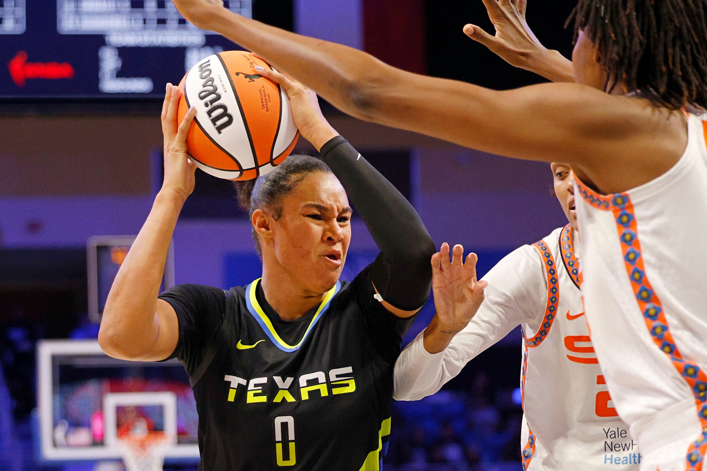 Dallas Wings forward Satou Sabally (0) looks to pass against Connecticut Sun during the...