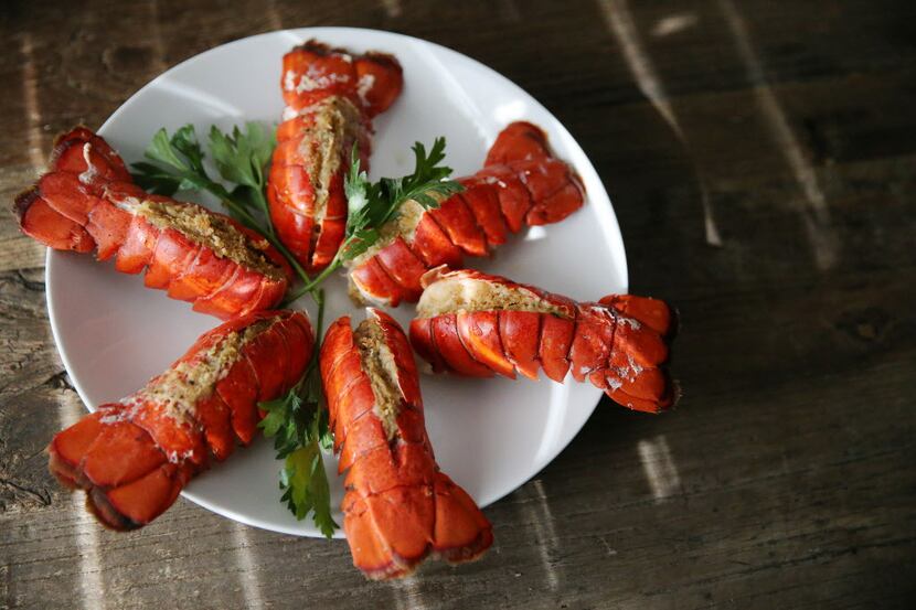 Lobster tails are photographed in preparation of a traditional Italian Christmas dinner at...