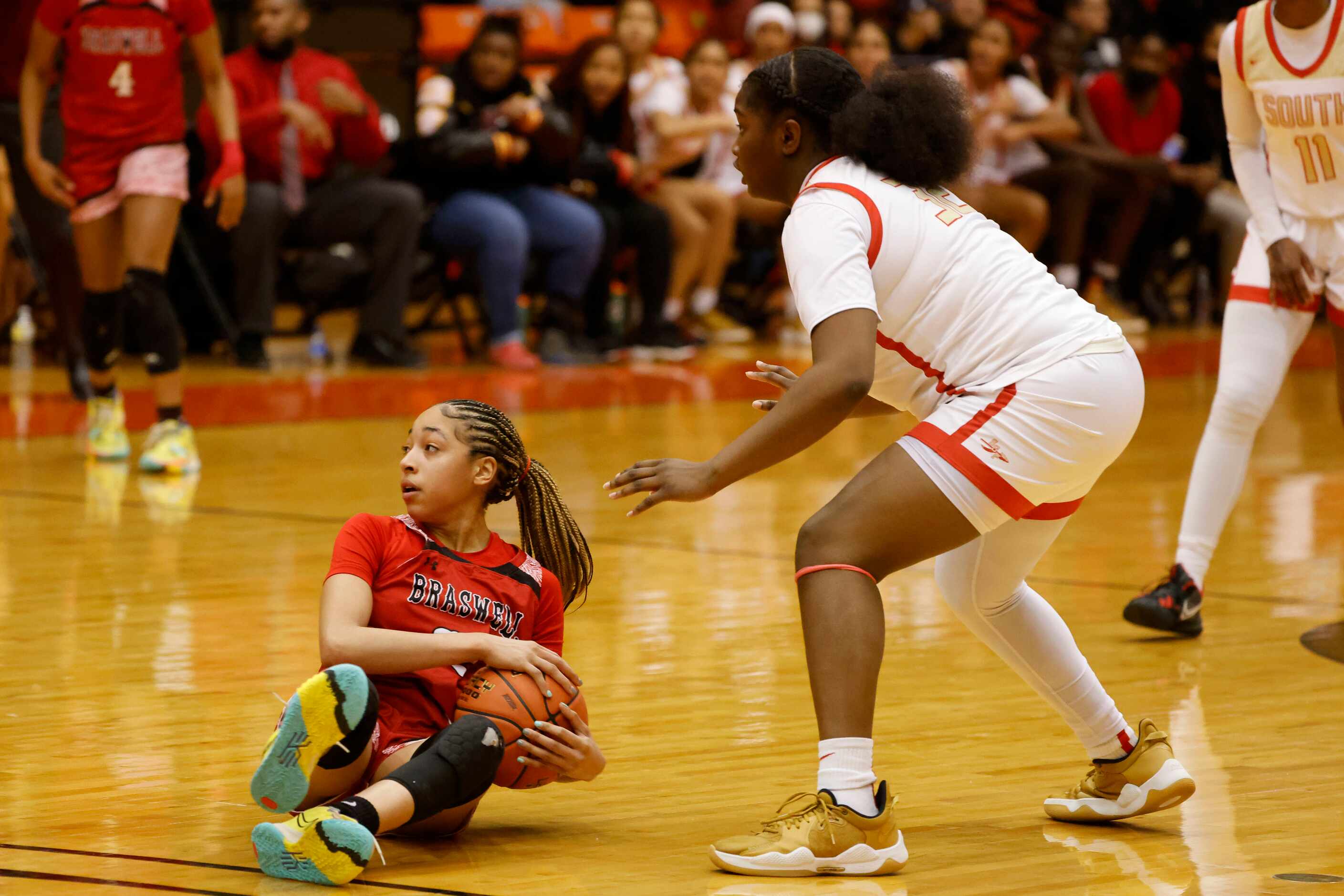 Denton Braswell’s Jazmyne Jackson, left, reacts to a travel call a she is defended by South...