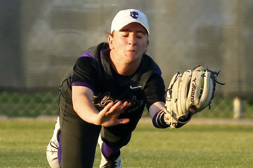 Keller Timber Creek outfielder Madie Green, pictured making a diving catch in the playoffs...