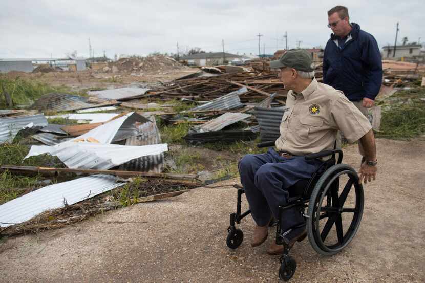Texas Gov. Greg Abbott surveyed damage on Pearl Street in Rockport on Monday following...