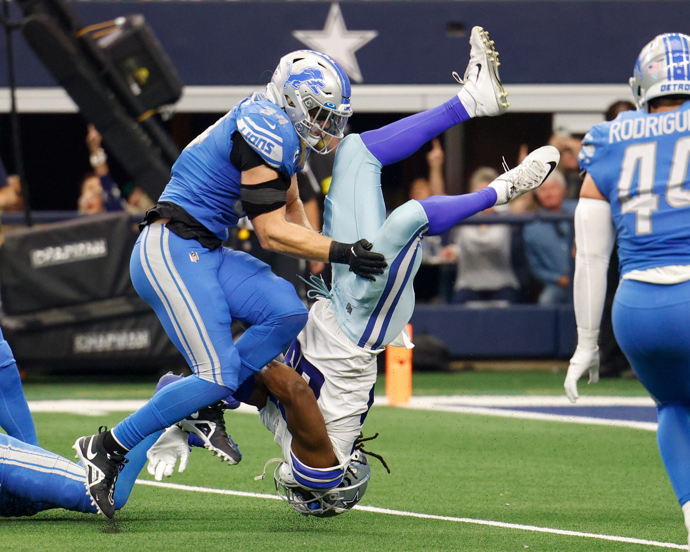 Detroit Lions linebacker Alex Anzalone (34) hits Dallas Cowboys wide receiver Noah Brown...