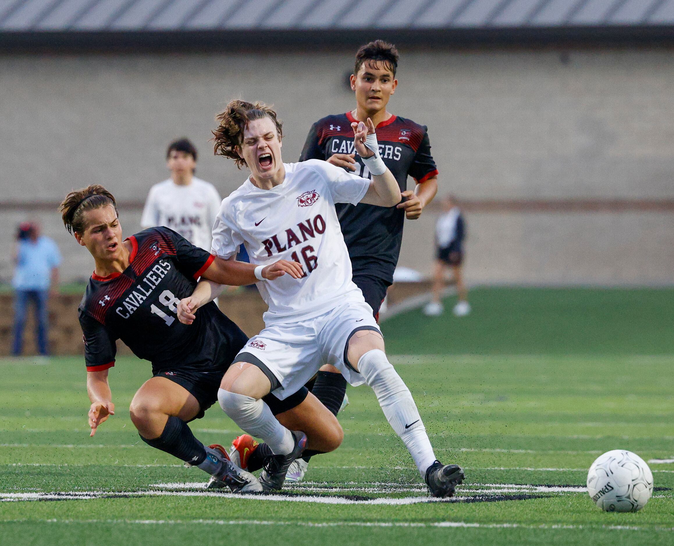 Plano forward Nolan Giles (16) reacts after being tackled by Austin Lake Travis midfielder...