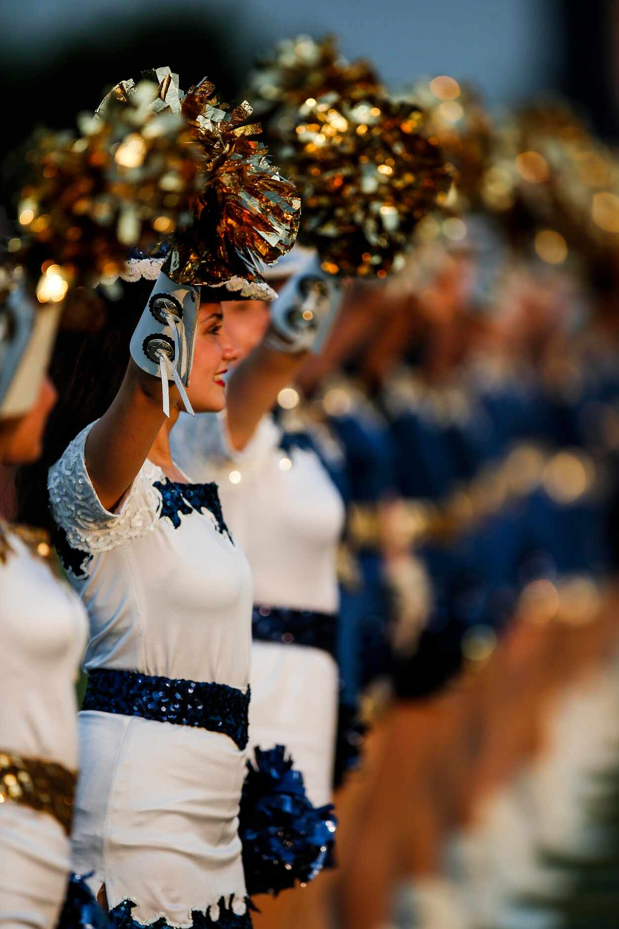 The Jesuit Rangerettes perform before the first half of a high school football game against...