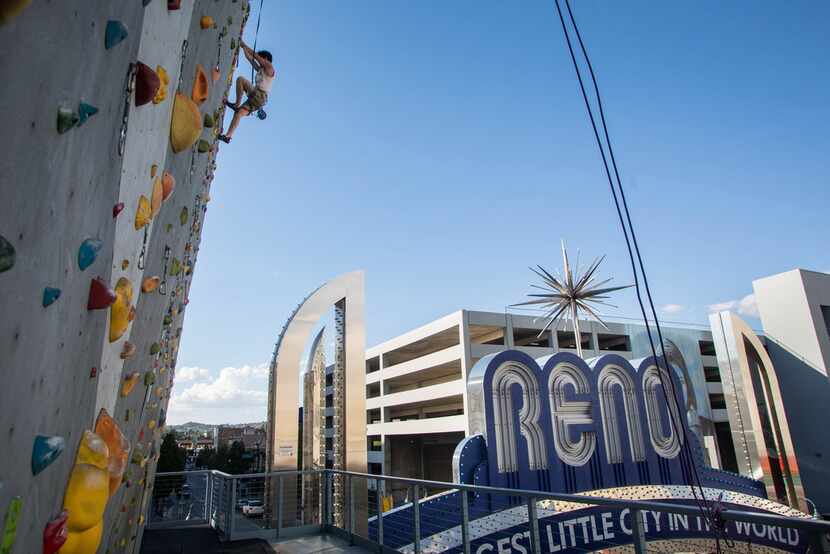 Robert Springs scales the climbing wall on the outside of the Whitney Peak Hotel in Reno. 