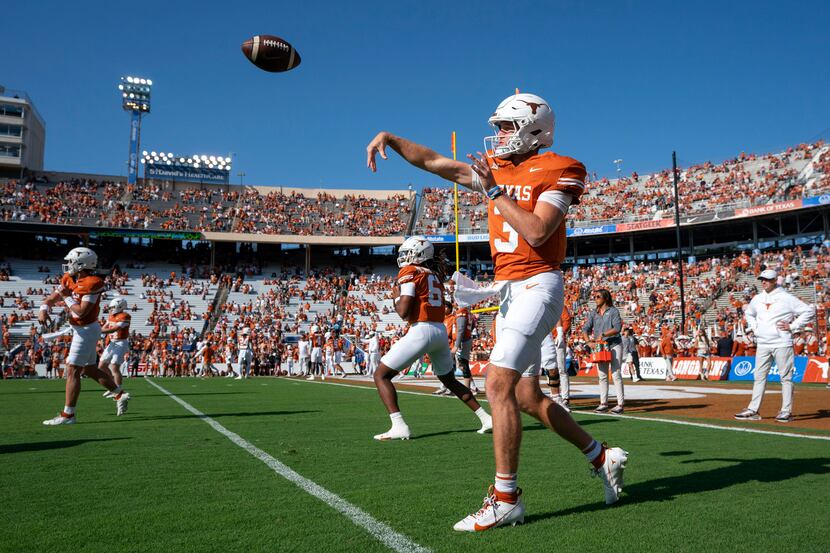 Texas quarterback Quinn Ewers warms up before an NCAA college football game against Oklahoma...