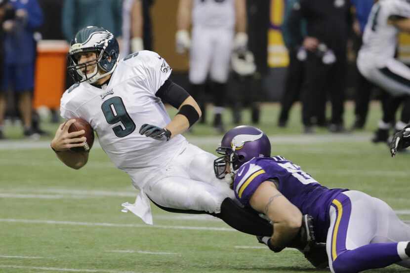 Philadelphia Eagles quarterback Nick Foles (9) is sacked by Minnesota Vikings defensive end...