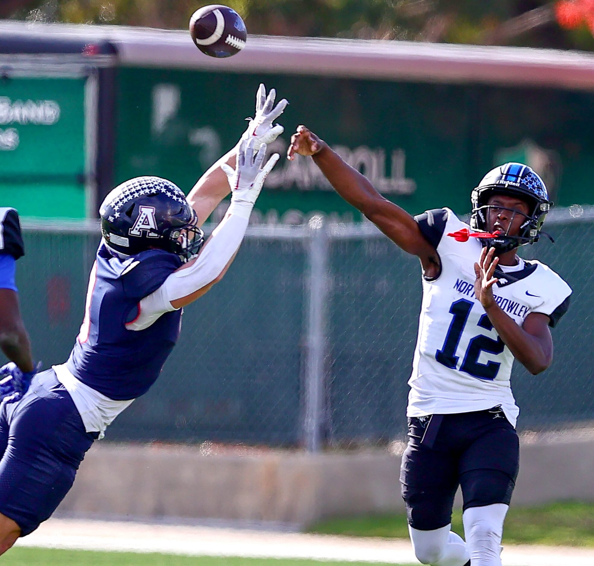 North Crowley quarterback Chris Jimerson Jr (12) gets off a pass against Allen linebacker...