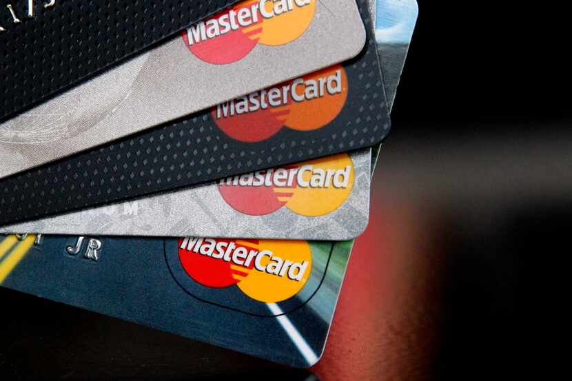 FILE - In this Thursday, April 25, 2013, file  photo, MasterCard credit cards are displayed...