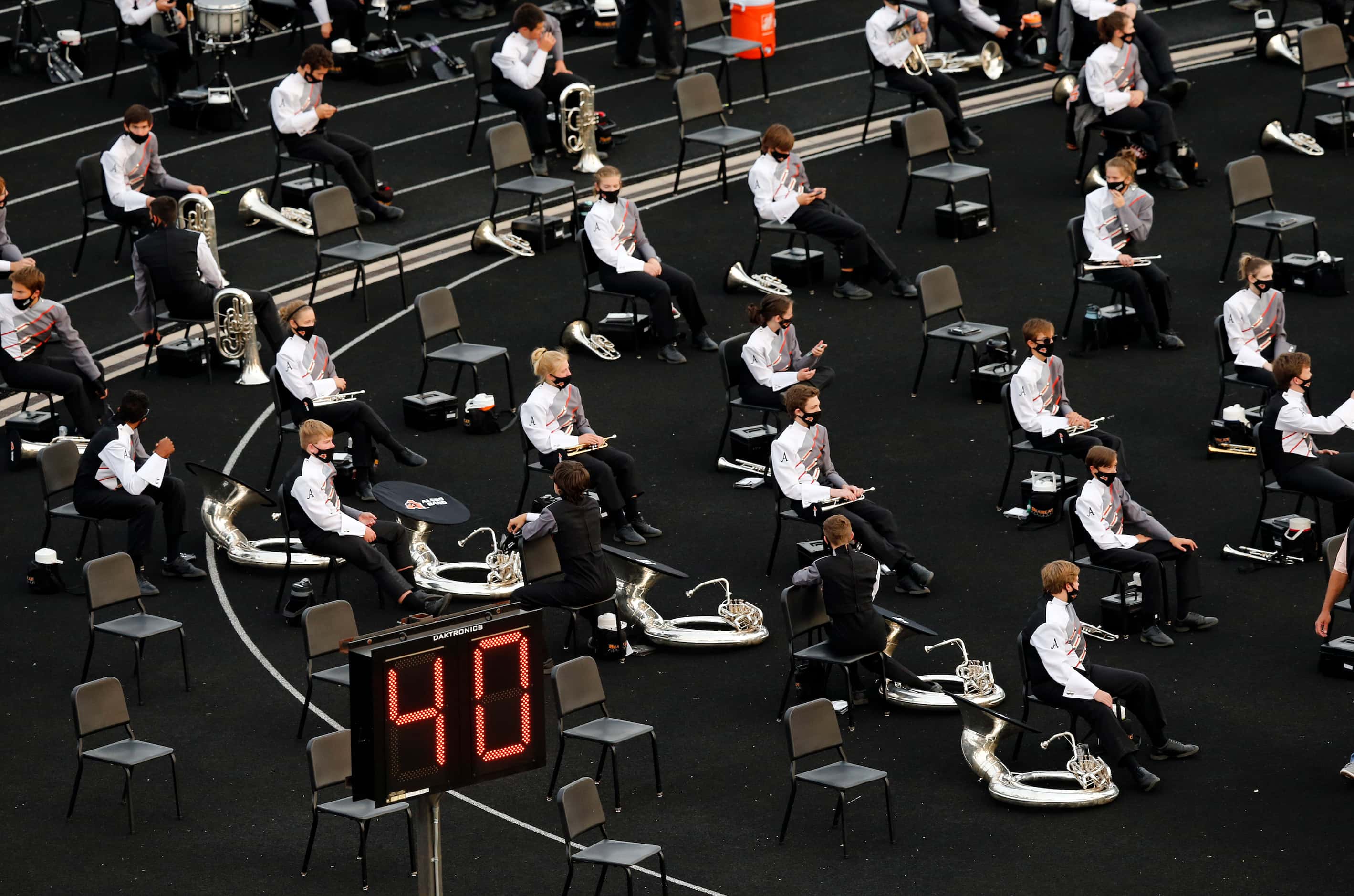 The Aledo band is socially-distanced as they wait to perform during the Frisco Lone Star...