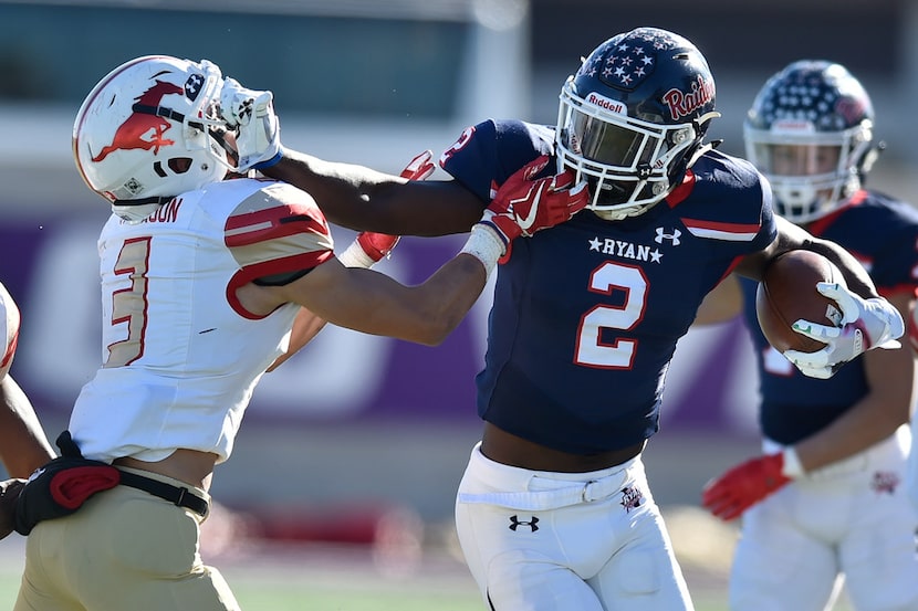 Ryan senior wide receiver Gabriel Douglas (2) catches a pass and stiff-arms Coronado junior...