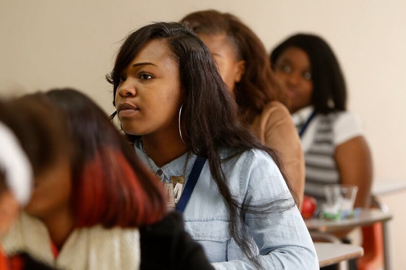 Glennecia Fields, a junior at Cedar Hill High School, listens during a workshop on teaching...
