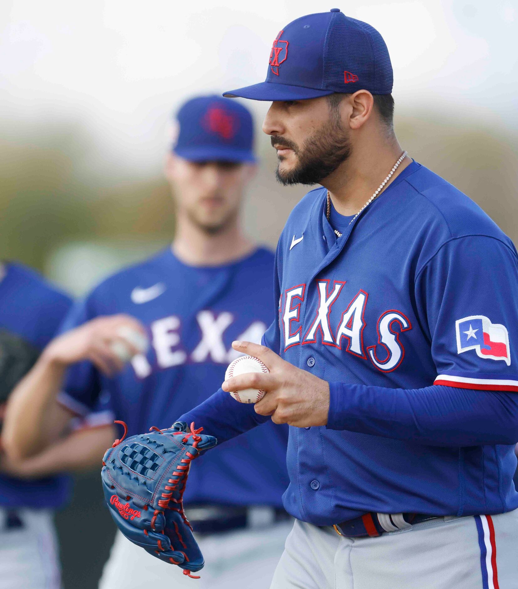 Texas Rangers pitcher Martín Pérez waits to pitch during a spring training workout at the...