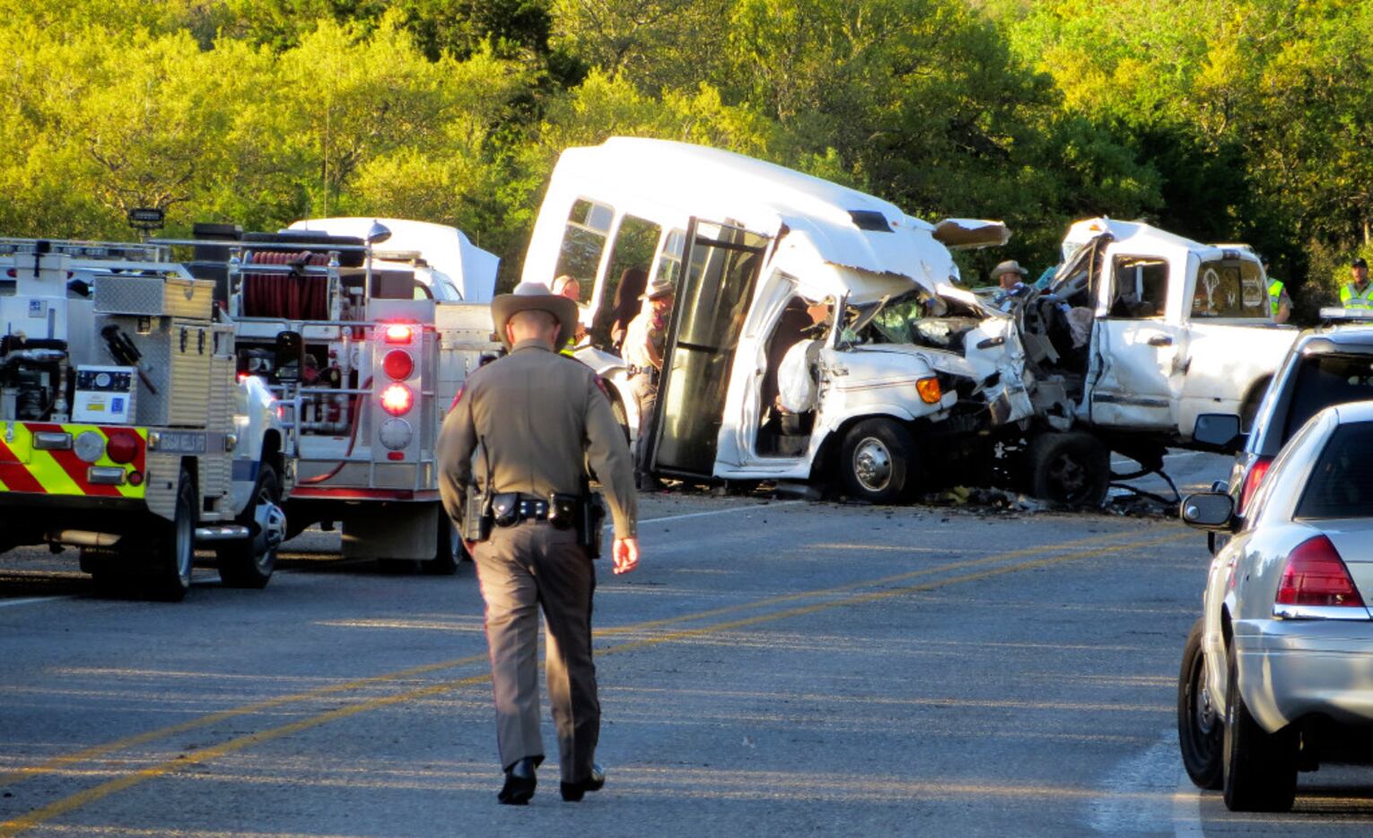 Authorities investigate after a deadly crash involving a van carrying church members and a...