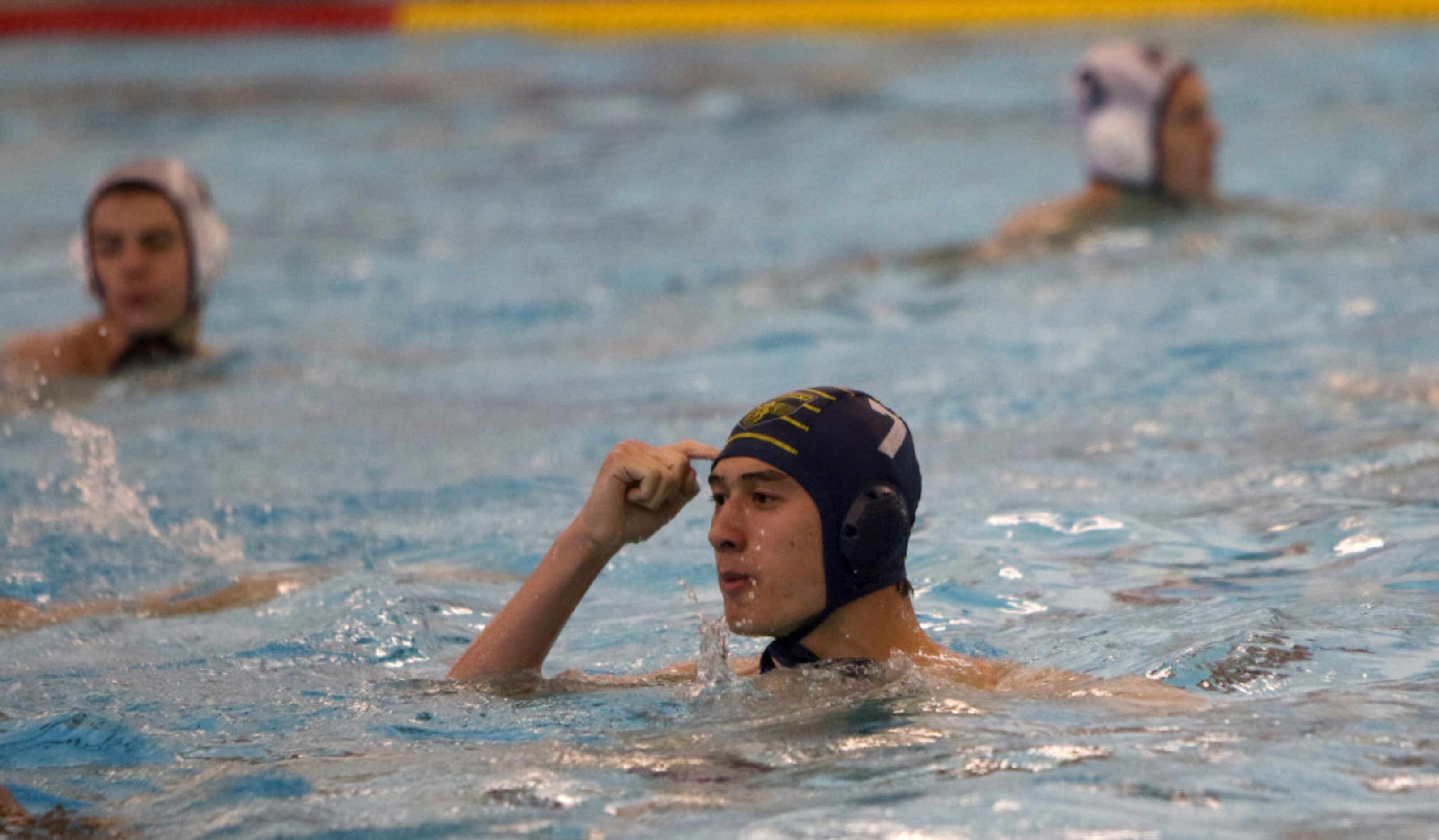 Andrew Lin (7) gestures to his teammates to "play smart" after his first quarter score...