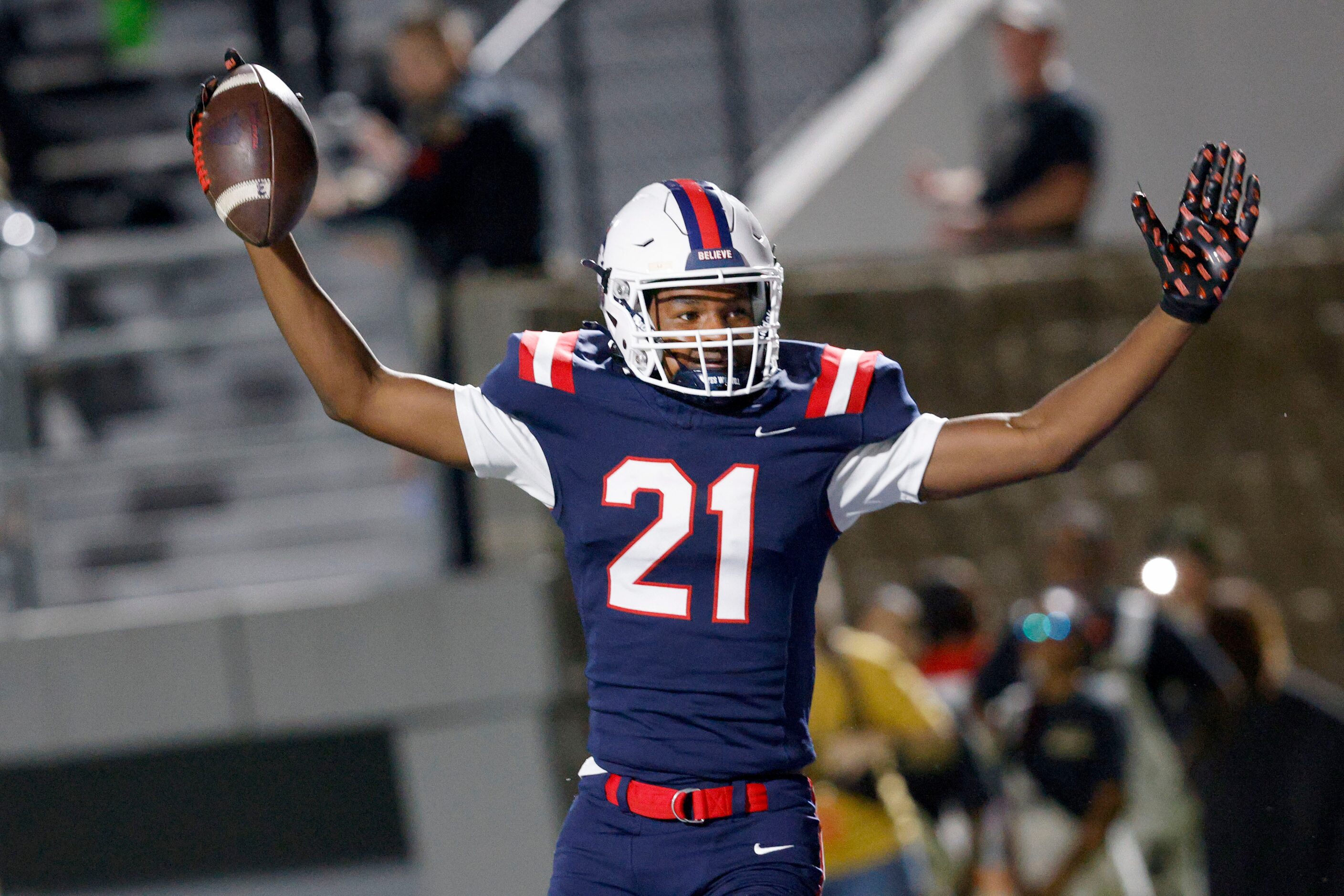 Richland's L.J. Allison (21) celebrates after scoring a touchdown in the second half of a...