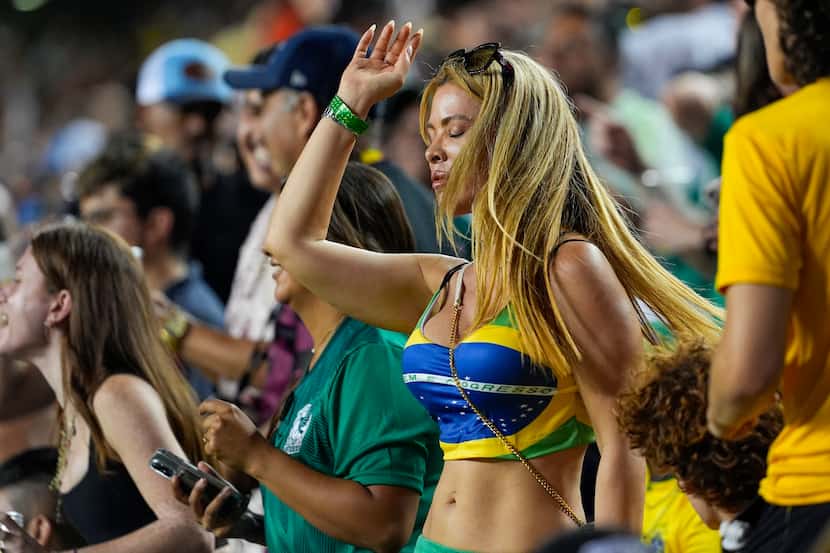 A Brazil supporter dances during the second half of an international soccer friendly match...