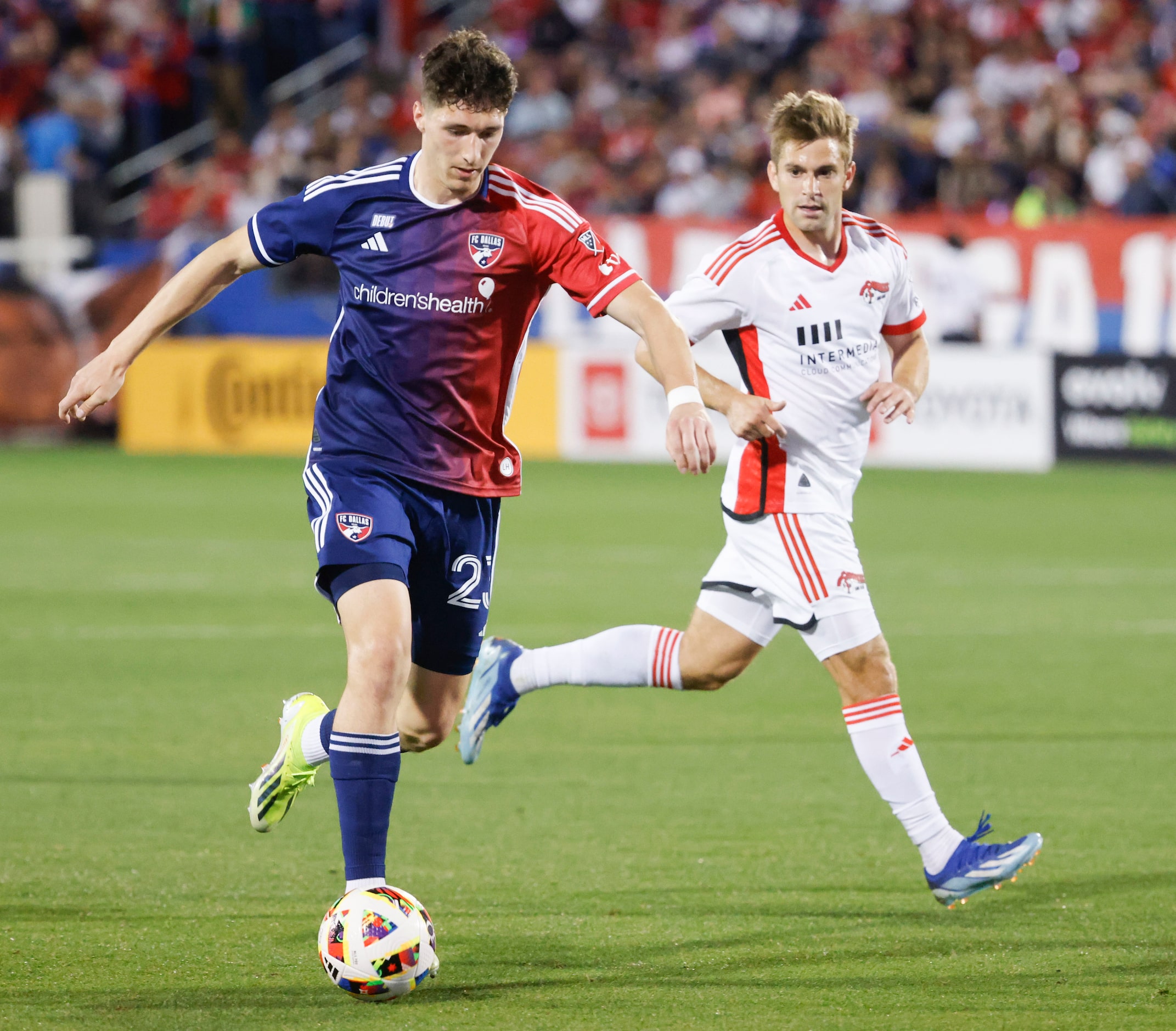 FC Dallas attacker Logan Farrington (left) dribbles past San Jose midfielder Jack Skahan...