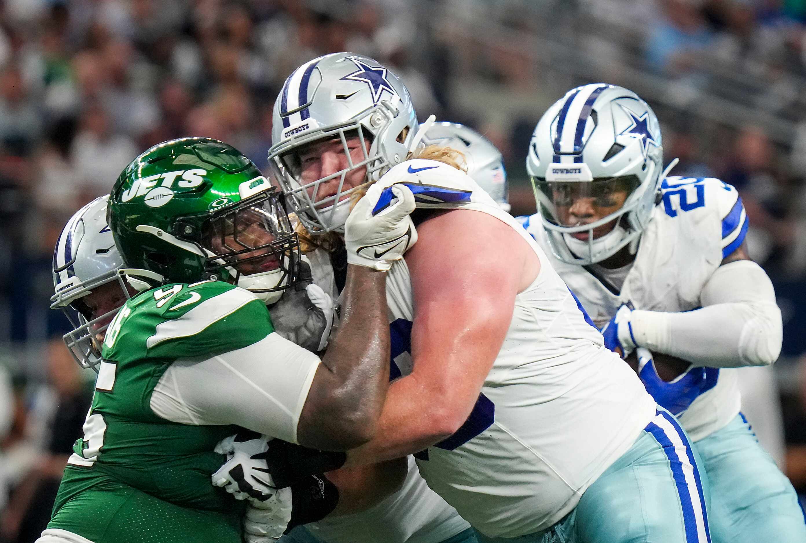 Dallas Cowboys guard T.J. Bass (66) works against New York Jets defensive tackle Quinnen...