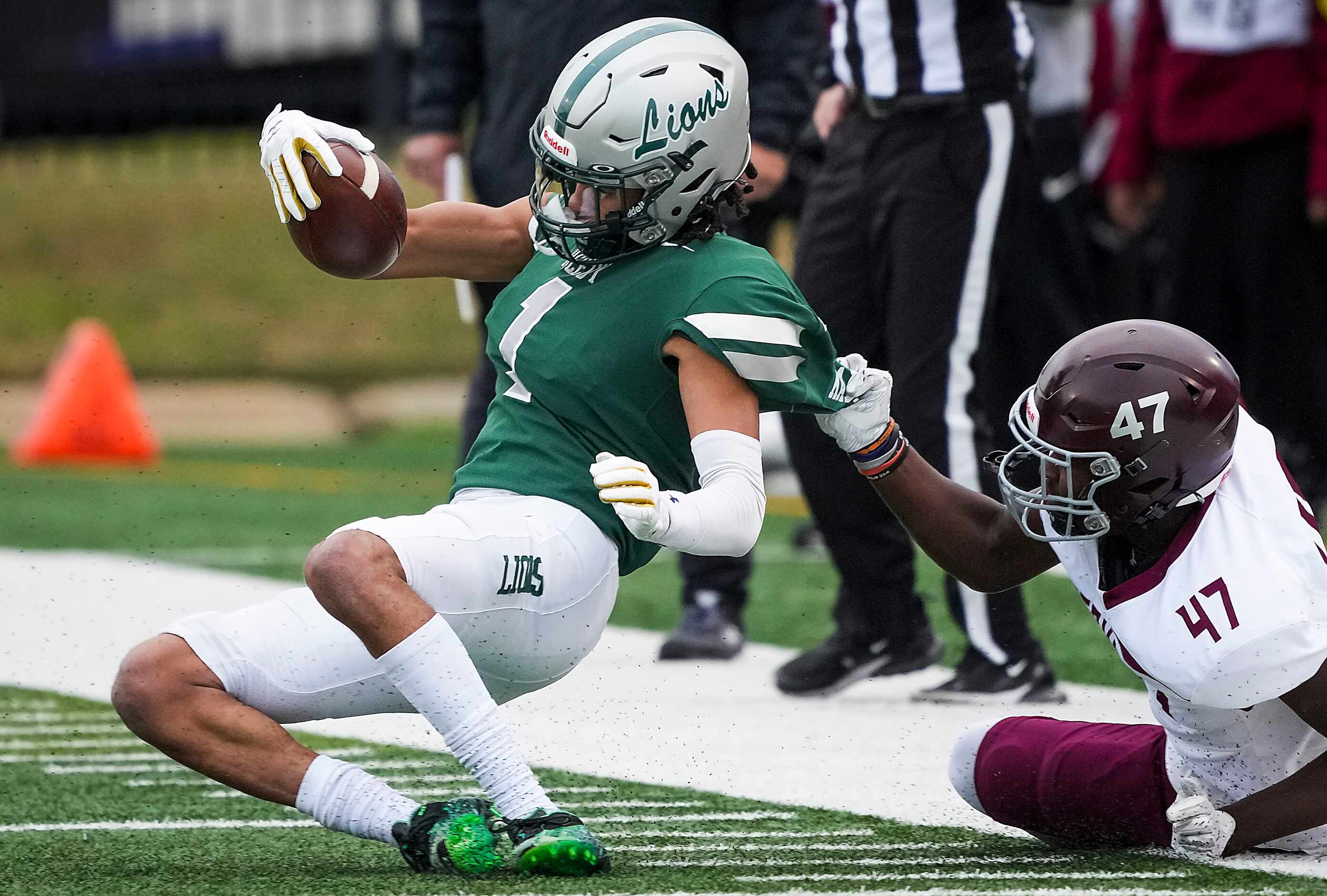 Frisco Reedy wide receiver Kaleb Smith (1) is pulled down by Mansfield Timberview linebacker...
