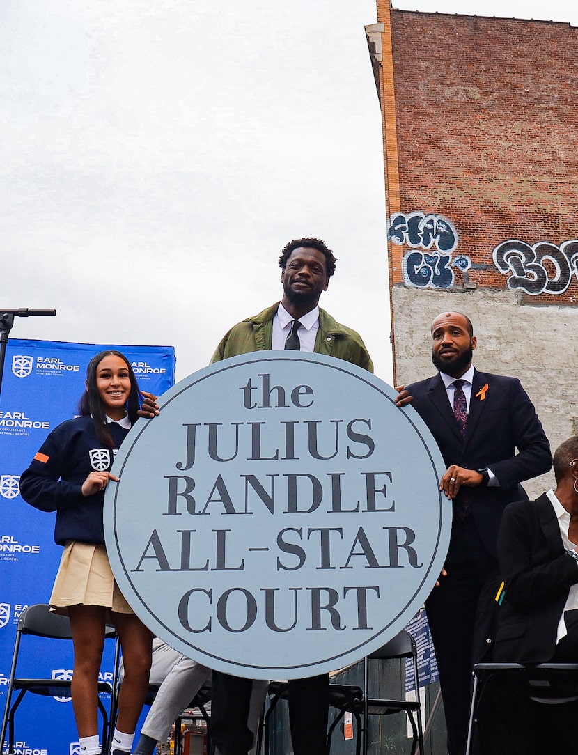 Dallas native Julius Randle (center) was honored this week in the Bronx, New York for his...