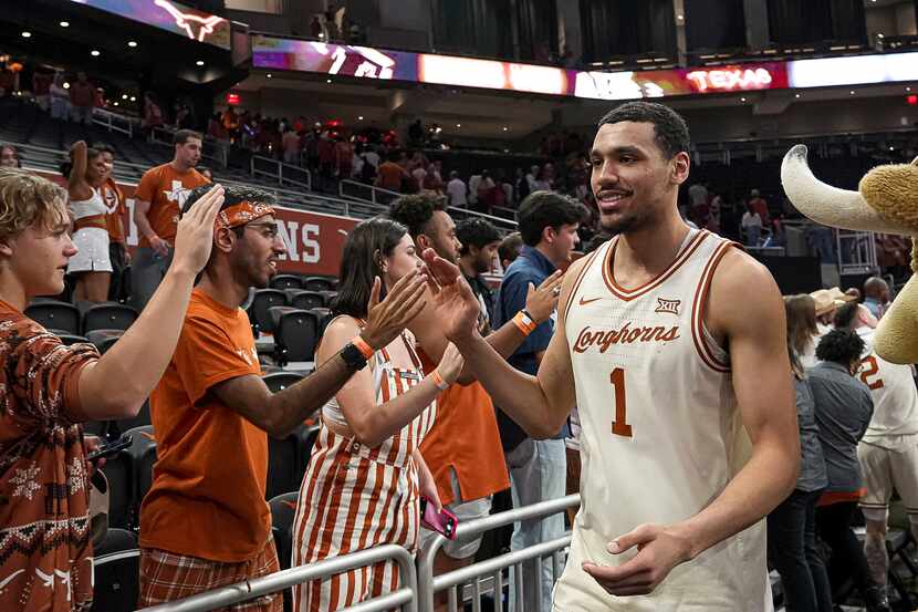 Texas forward Dylan Disu celebrates a win over Oklahoma State in an NCAA college basketball...