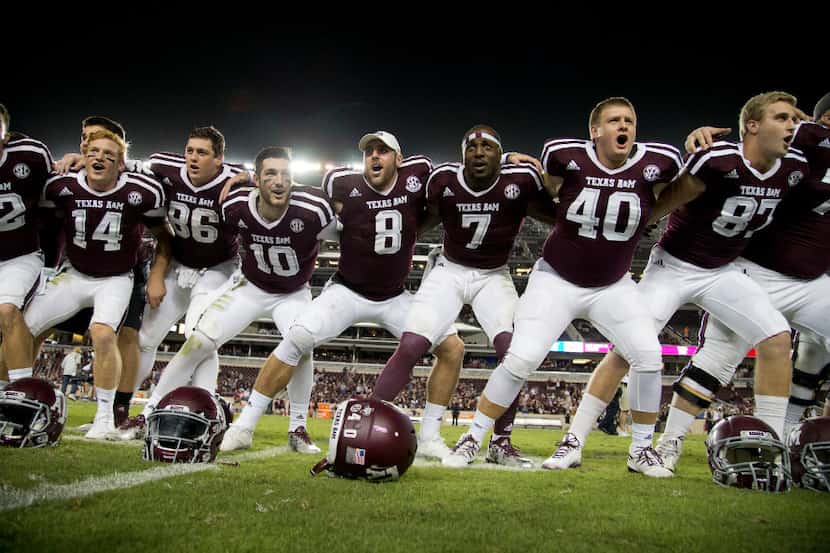 Texas A&M's Trevor Knight (8) sways along with teammates during the singing of the Aggie War...