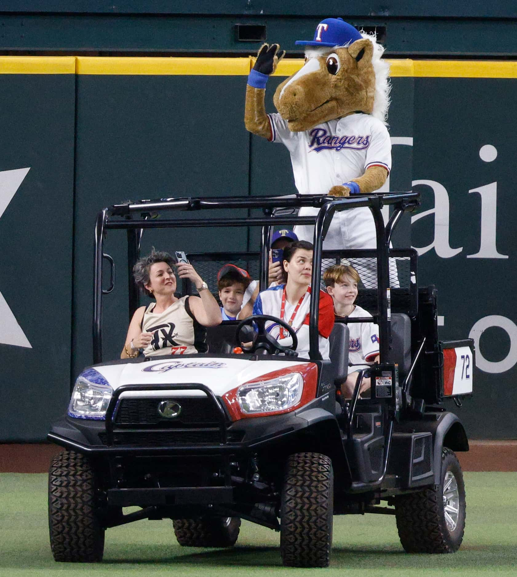 Rangers Captain, the mascot for the Texas Rangers, greet people before a baseball game...