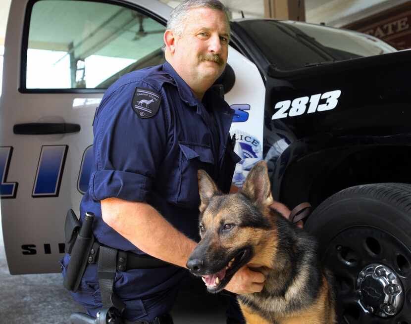 Dallas police Senior Cpl. Craig Woods with his police dog  El. 