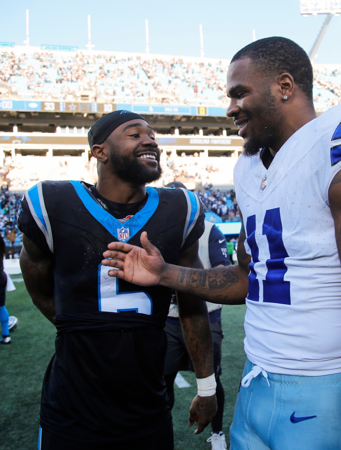 Carolina Panthers running back Miles Sanders (6) and Dallas Cowboys linebacker Micah Parsons...