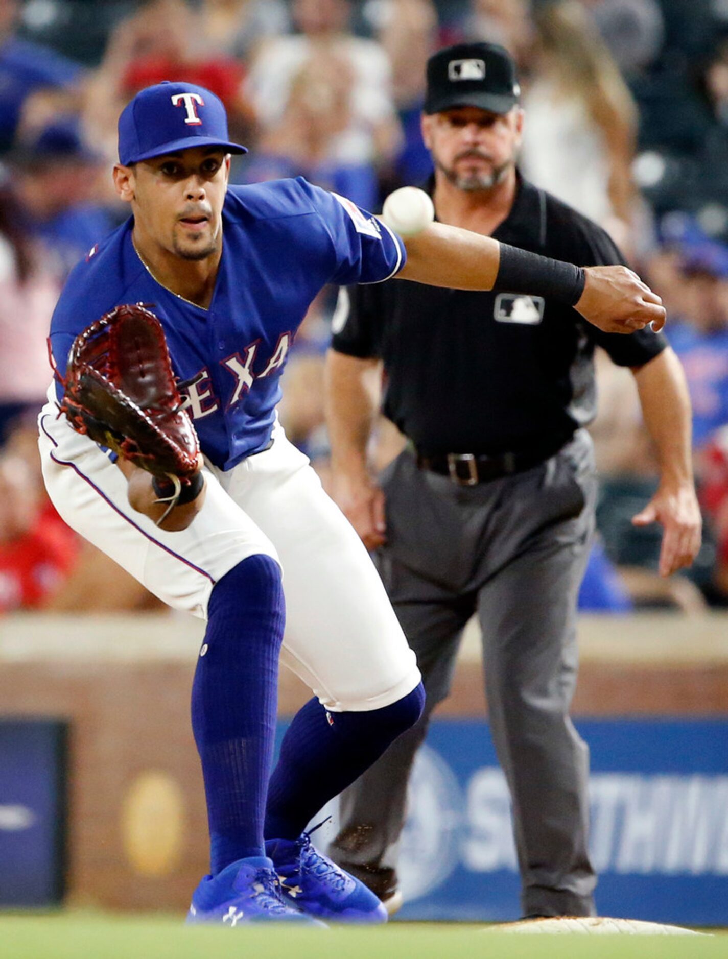 Texas Rangers first baseman Ronald Guzman (11) turns the front end of a double play getting...