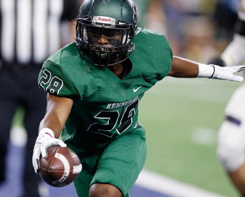 Kennedale's DJ Kirven (28) runs into the end zone for a touchdown in a game against...