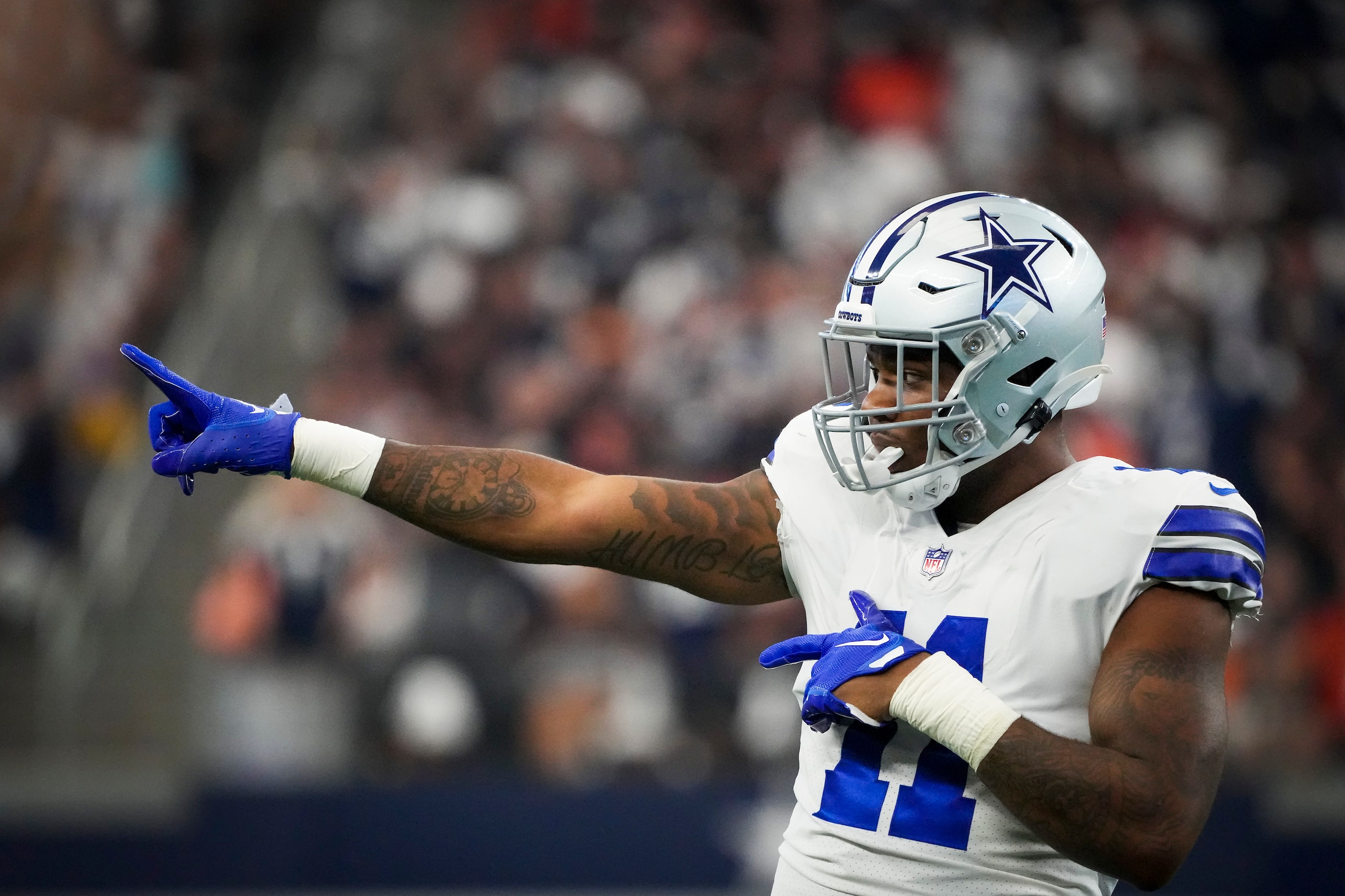 Dallas Cowboys linebacker Micah Parsons (11) celebrates after sacking Cincinnati Bengals...