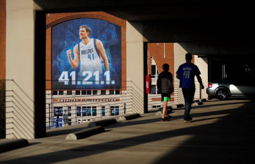 Dallas Mavericks fans Matt Pair of Waco and his 11 yr-old son Layton view the All-Star...