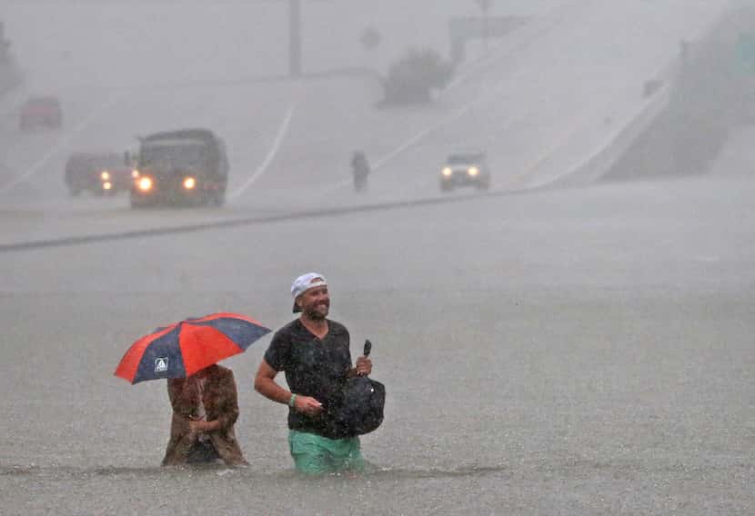 Motorists stranded in the flooding on  Loop 610 south near the Post Oak exit in Houston made...