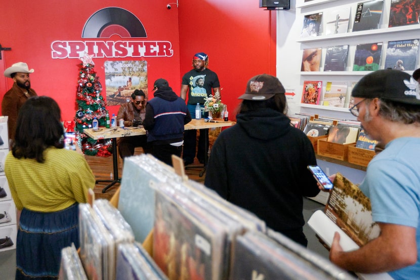 Leon Bridges signs autographs as fans wait in line at an album signing at Spinster Records...