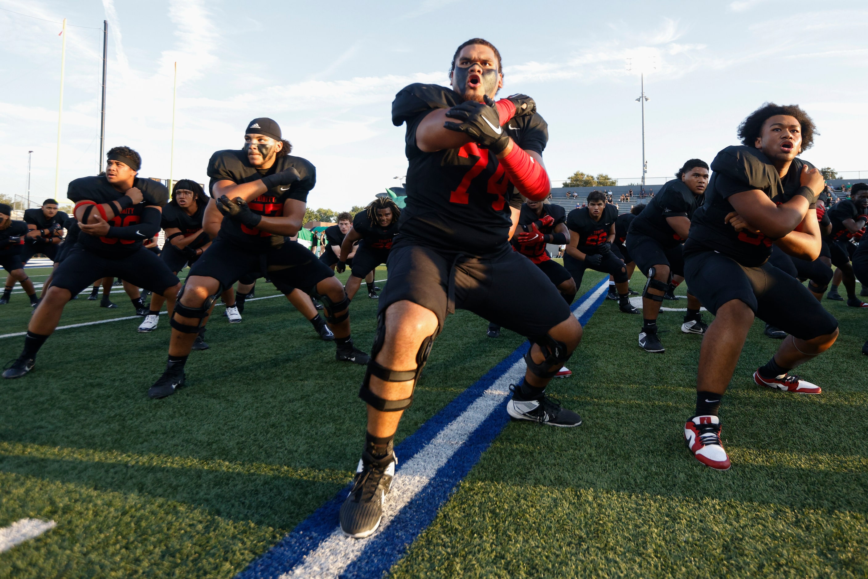 The Euless Trinity football team does the Sipi Tau before the first half of a District 4-6A...