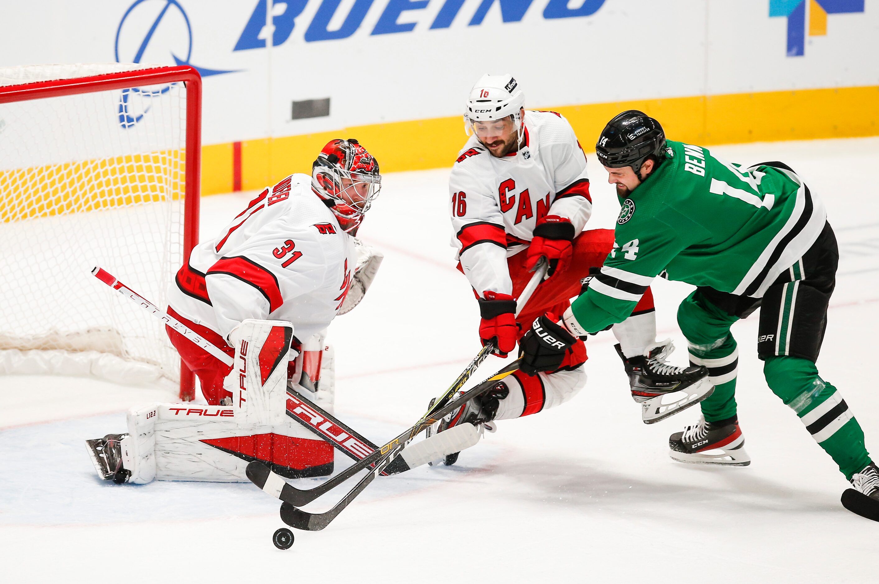 Dallas Stars forward Jamie Benn (14) attempts a shot as Carolina Hurricanes forward Vincent...