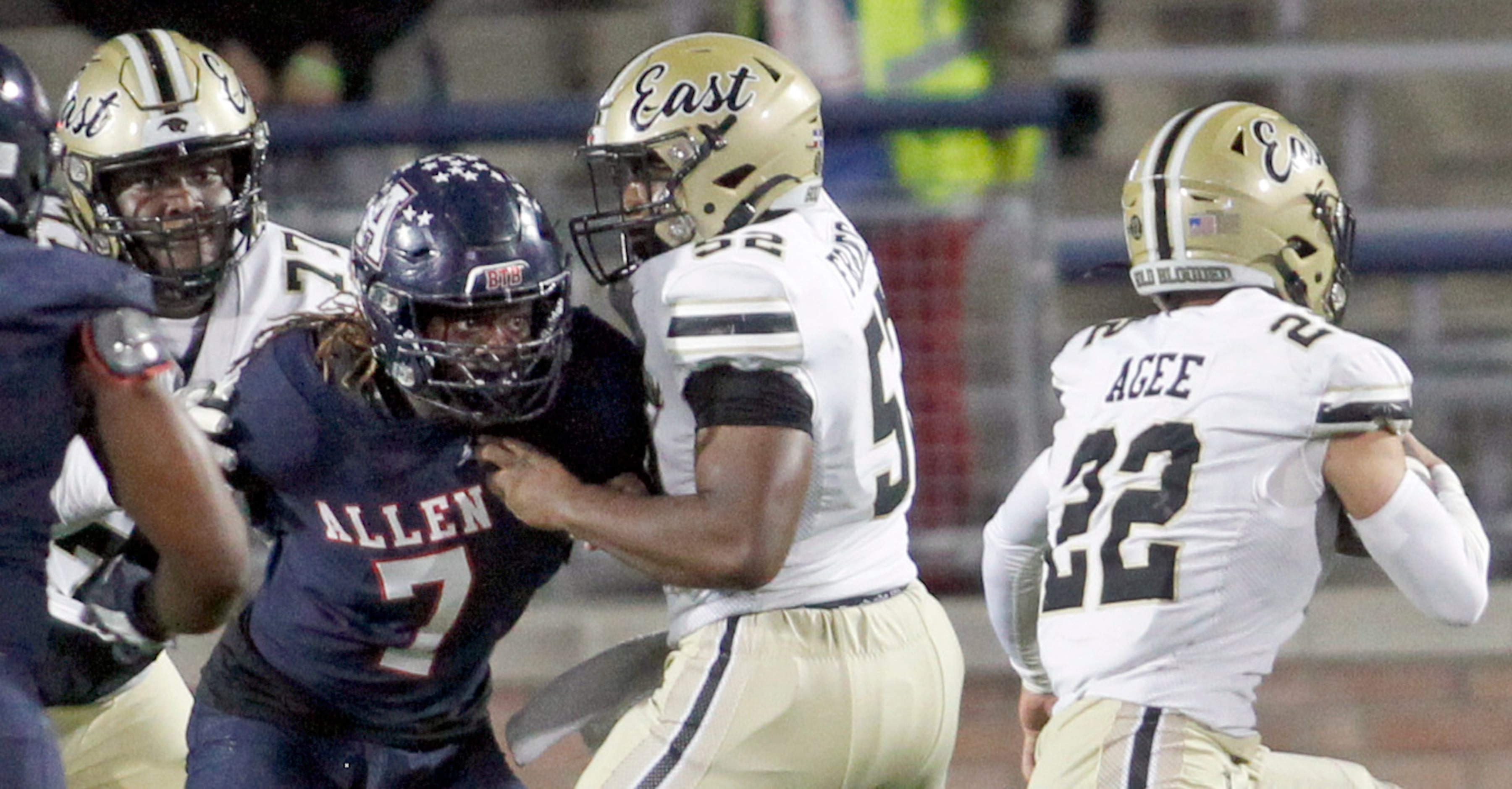 Allen linebacker Ja'Prie Wafer (7), left, splits the blocking of Plano East offensive...