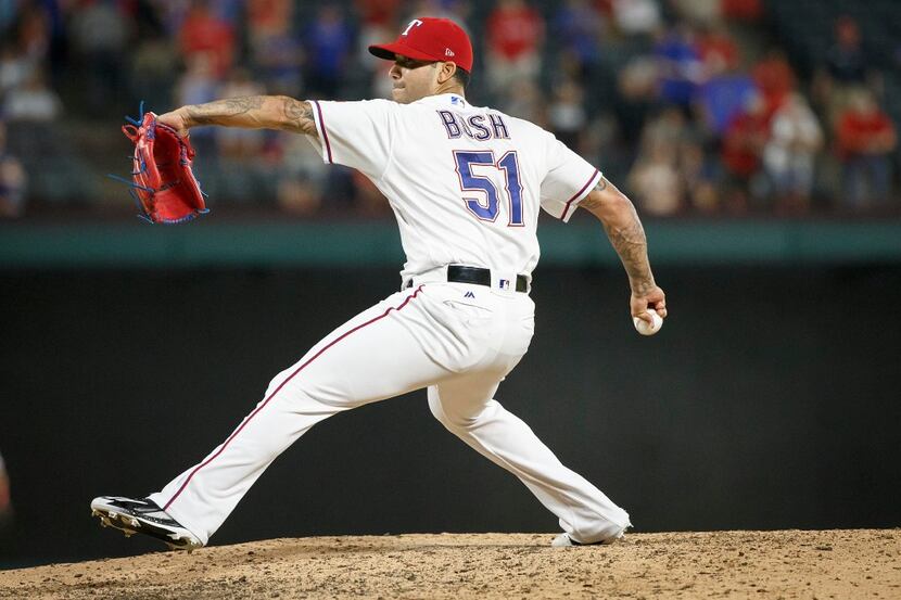 Texas Rangers relief pitcher Matt Bush pitches during the ninth inning against the Tampa Bay...