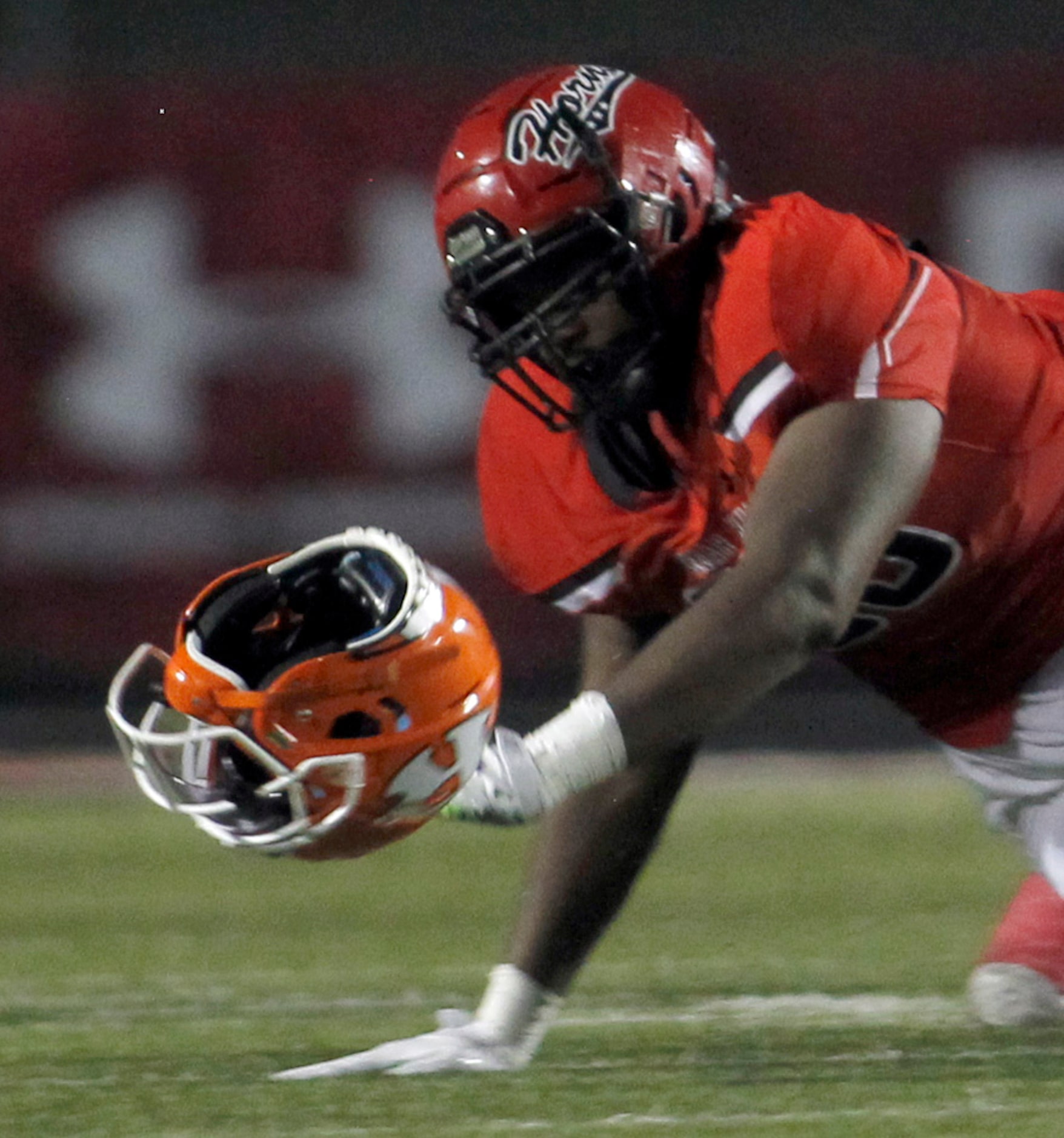 Cedar Hill Longhorns defensive end Syncere Massey (90) eyes the empty helmet as it got...