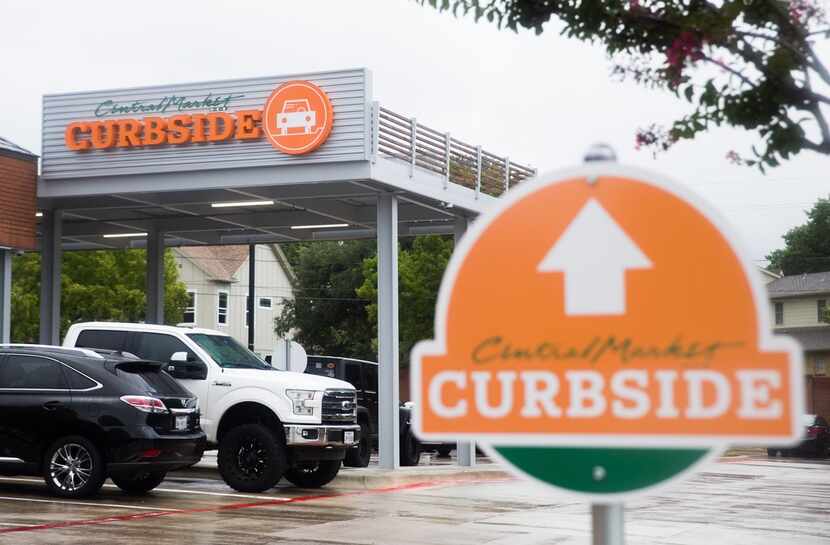 The curbside pickup area can be seen at Central Market on West Northwest Highway on Monday,...