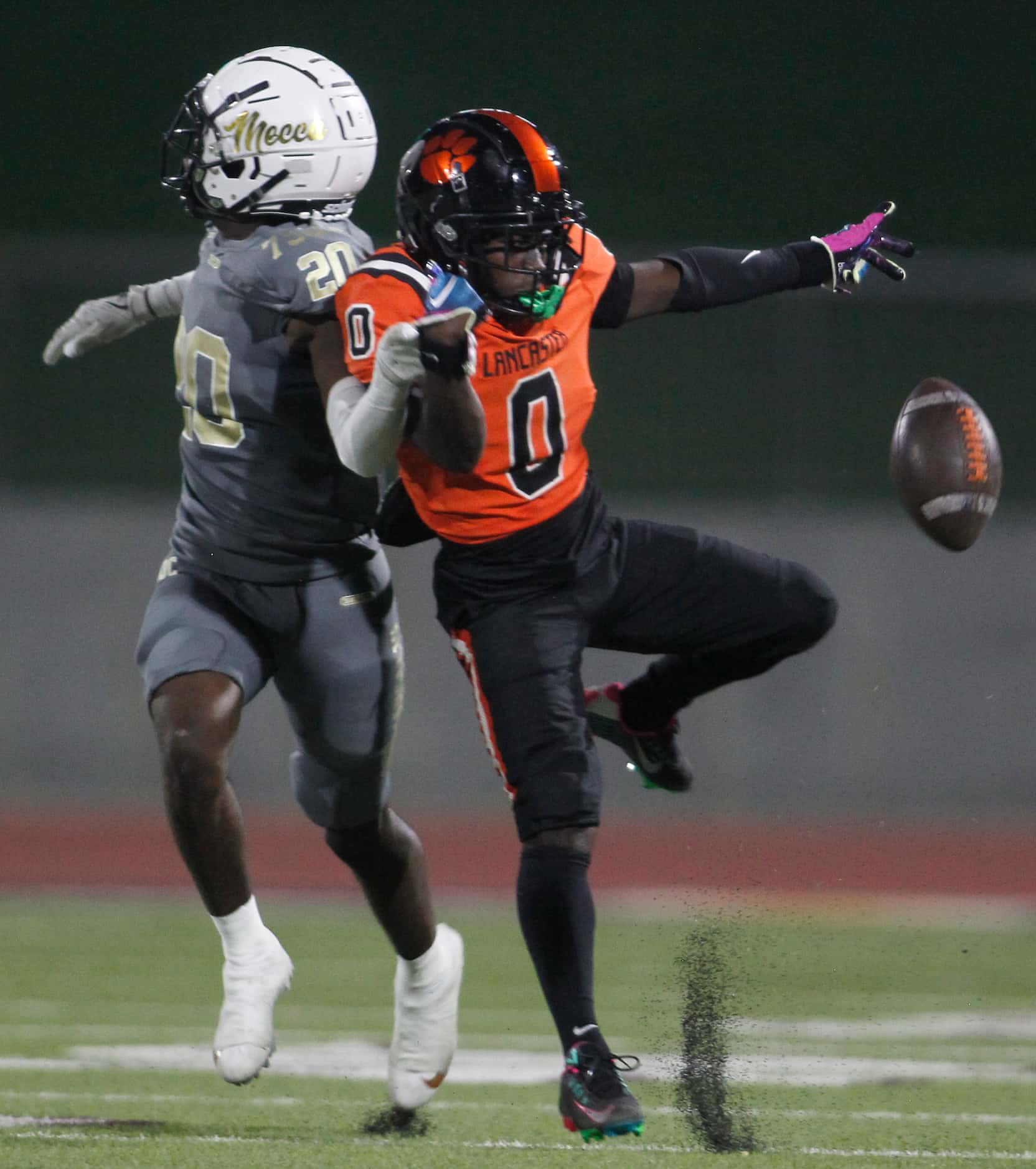 Lancaster receiver Ti'Erick Martin (0) gets tangled with South Oak Cliff defensive back...