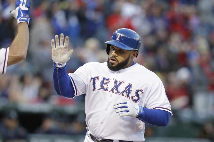 Texas Rangers Prince Fielder is congratulated after his solo home run during the second...