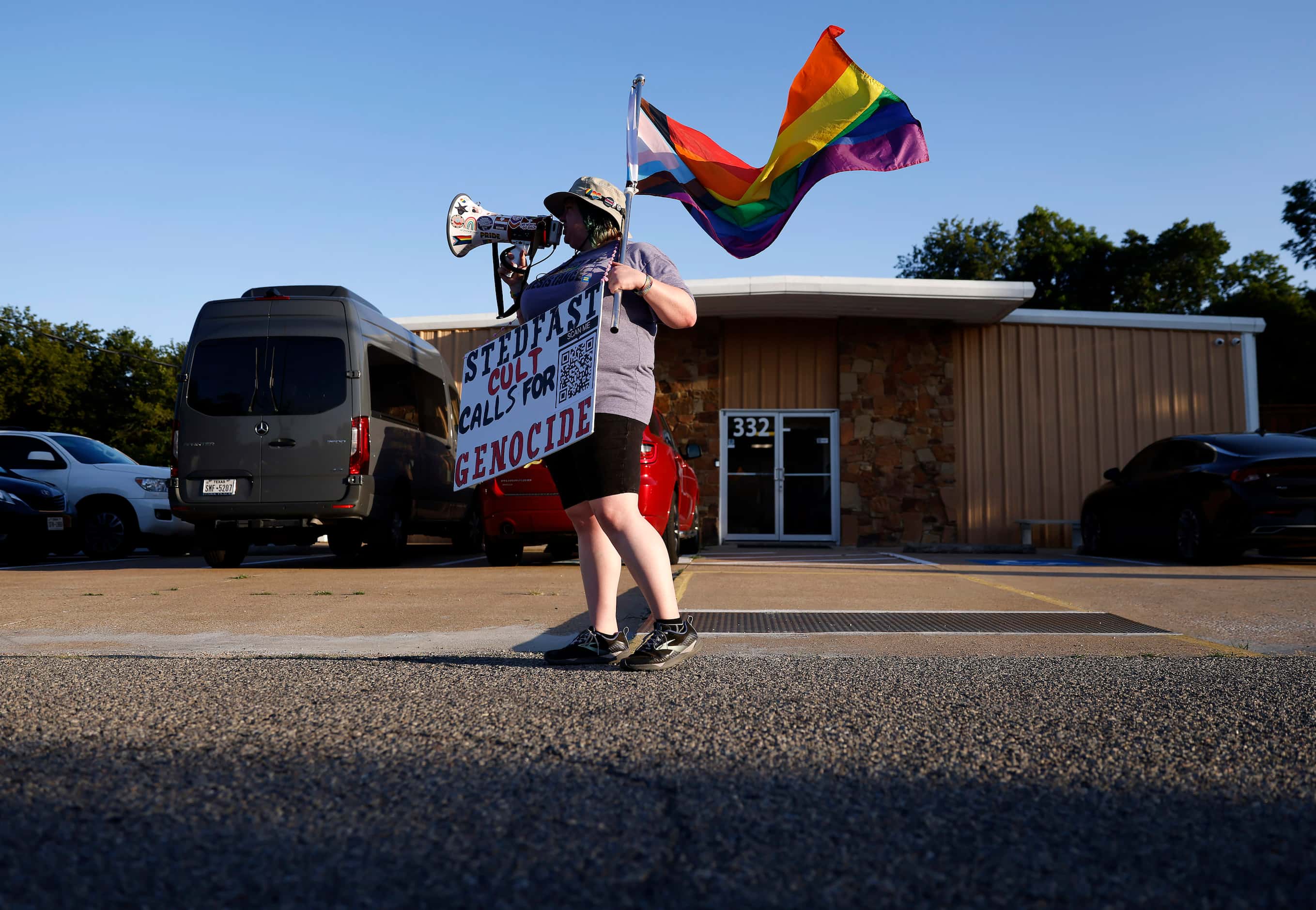 Protestor ‘Rain’ Knight of No Hate In Texas paces back and forth in front the New...