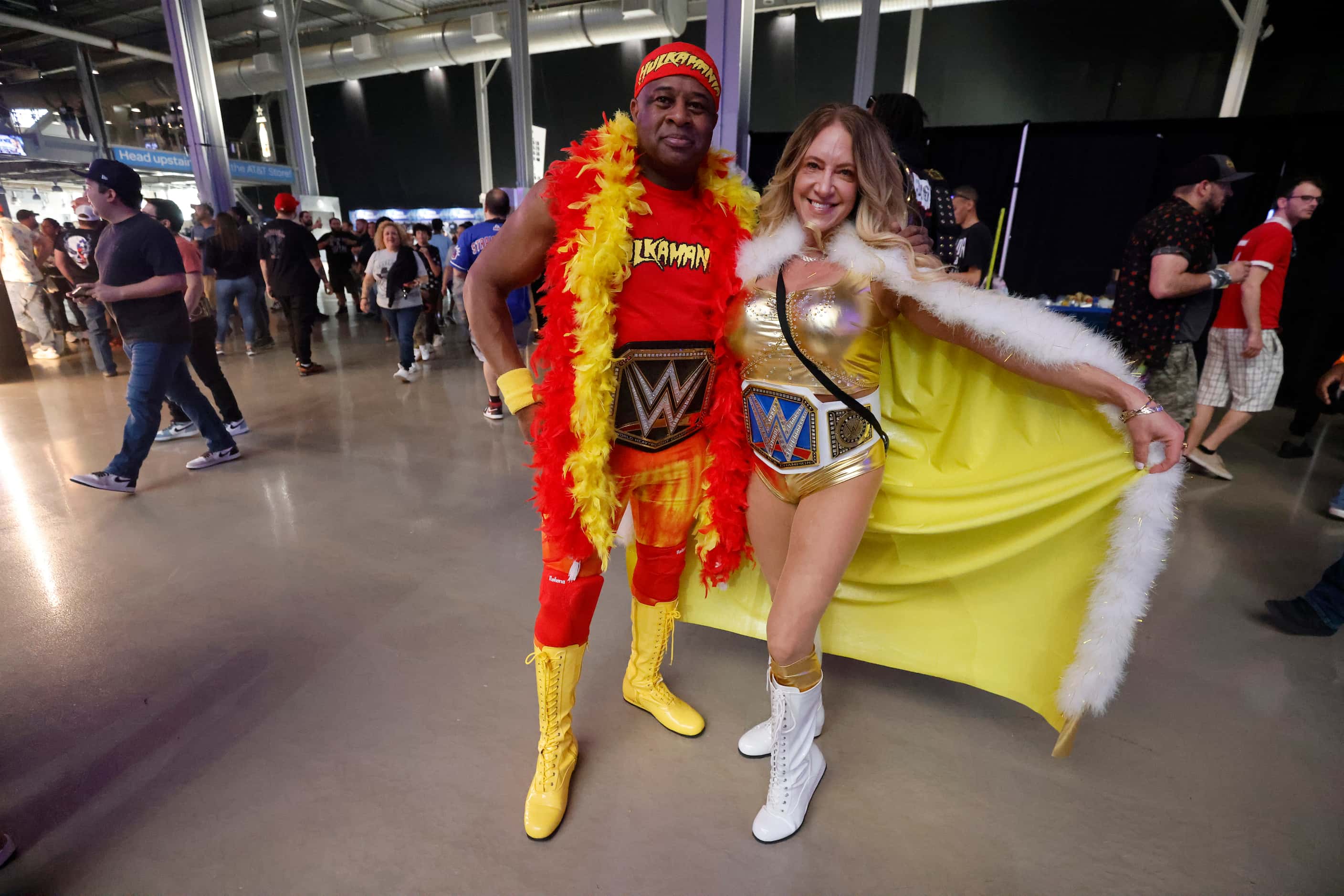 Fans pose during WrestleMania in Arlington, Texas on Saturday, April 2, 2022. 