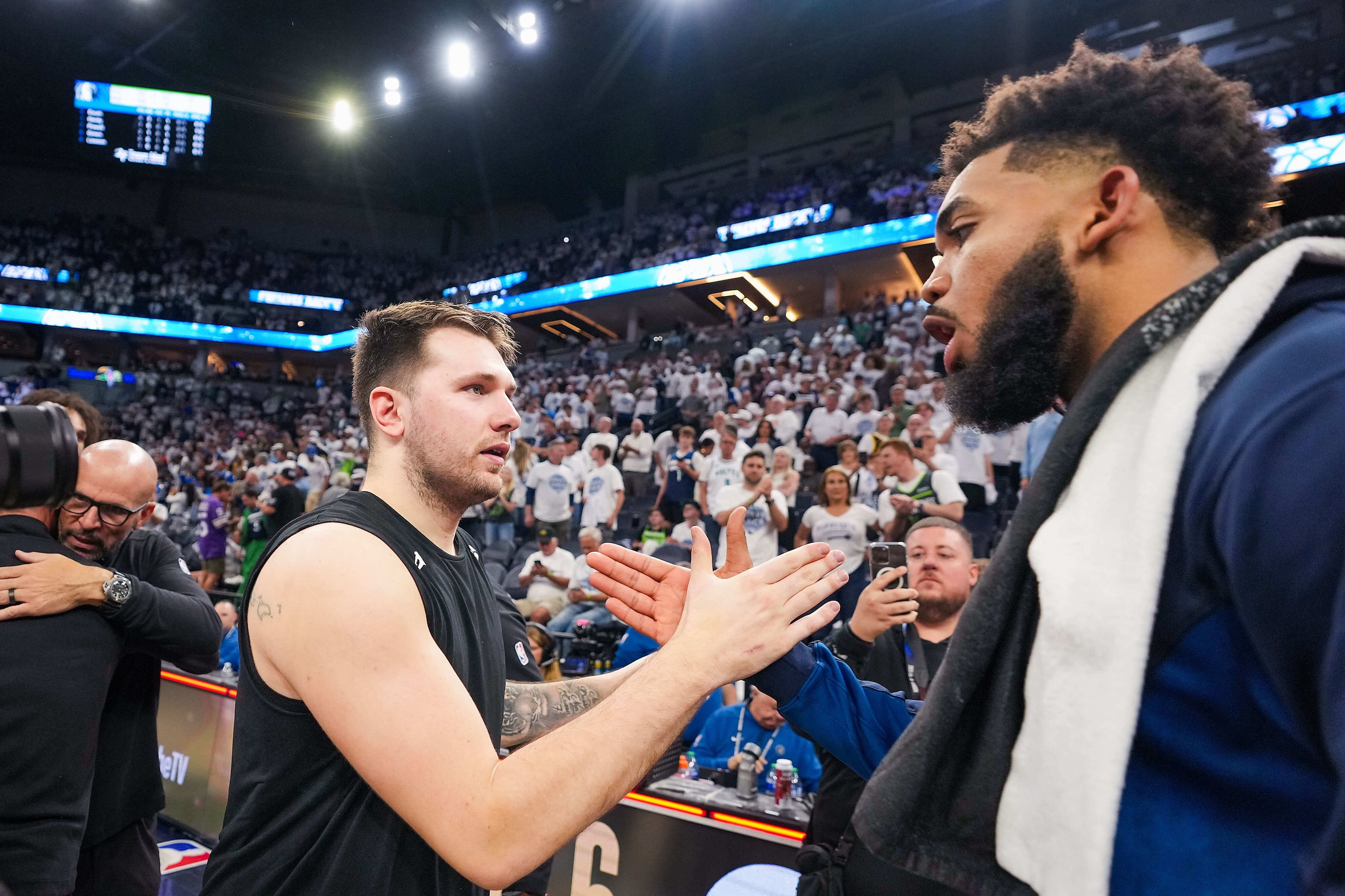 Dallas Mavericks guard Luka Doncic shakes hands with Minnesota Timberwolves center...