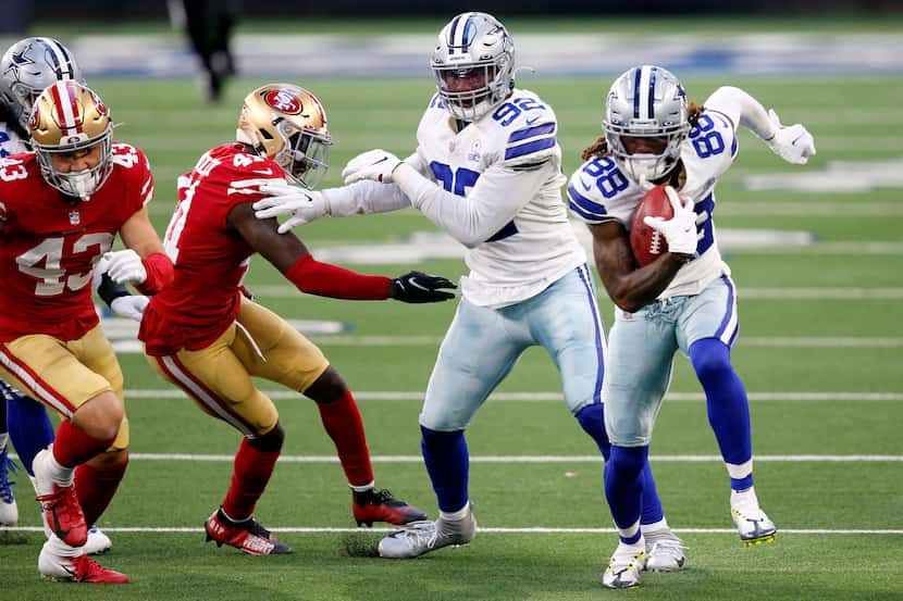 Dallas Cowboys wide receiver CeeDee Lamb (88) picks up an onside kick and races for a fourth...