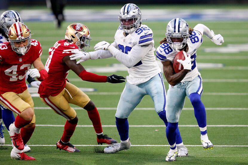 Dallas Cowboys wide receiver CeeDee Lamb (88) picks up an onside kick and races for a fourth...